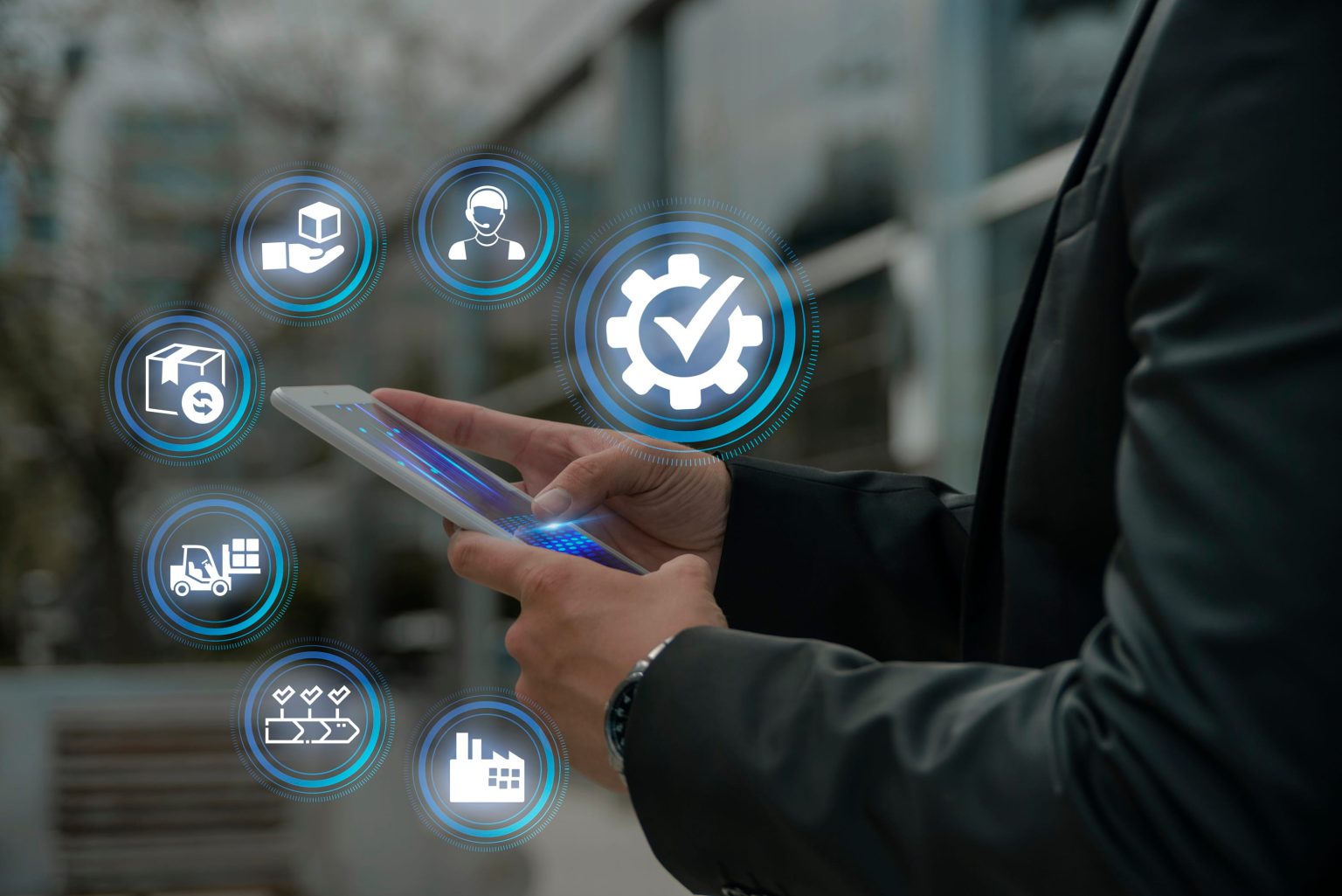 Business professional using a mobile device with digital icons representing managed IT services and business technology.