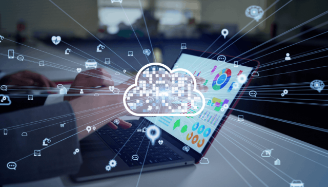 Business professional using a laptop with cloud graphics and data visualisations, representing cloud services and the difference between IaaS, PaaS and SaaS