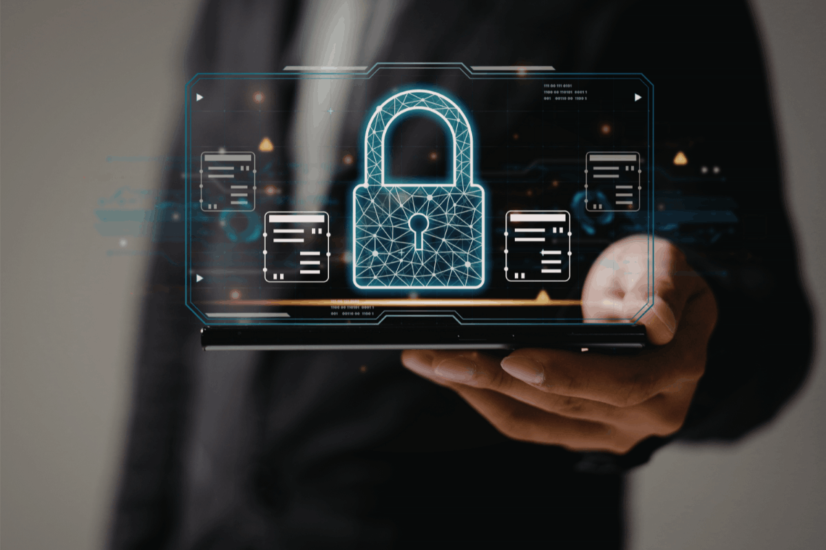  Person holding a smartphone displaying a holographic padlock.